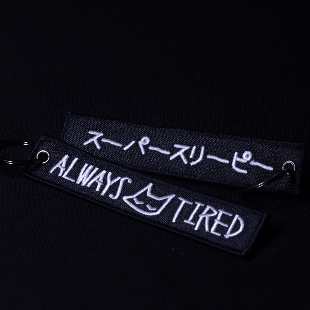 always tired (flight tag) - triple cat deluxe